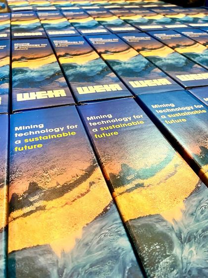 Here are custom-sleeved gift boxes prepared for Weir, a company focused on mining technology. The packaging is designed to reflect their brand's mission for a sustainable future.