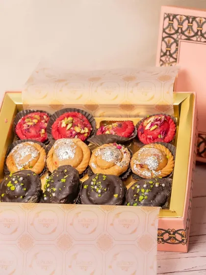 A box of my assorted fusion gujiyas, featuring flavours like classic, rose, and chocolate pistachio. Each one is handcrafted to perfection for your Holi celebrations.