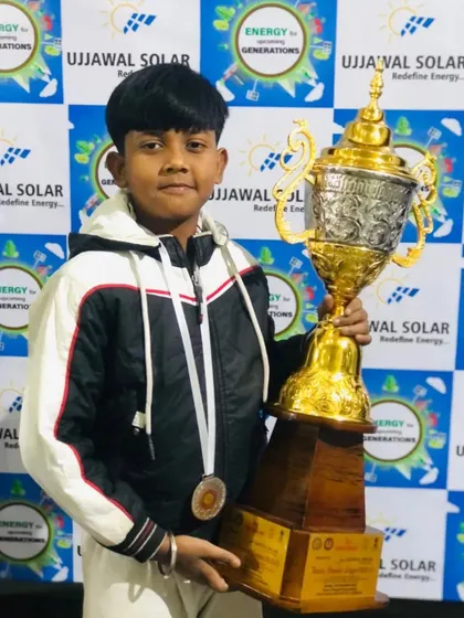 Harsh, another one of my champions, holding the trophy he helped win for the team.