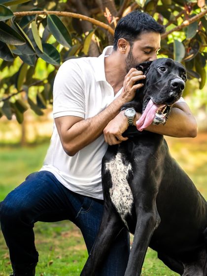 A sweet kiss for a very good boy. This candid shot perfectly captures the affection in their relationship.
