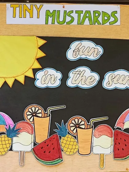 Welcome to our "Fun in the Sun" summer camp. This colorful board, created with the children, sets the theme for a season of creative crafts, tasty fireless cooking, and exciting new discoveries.