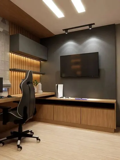 Another view of the gaming room, highlighting the fluted wood paneling and the sleek, modern furniture.