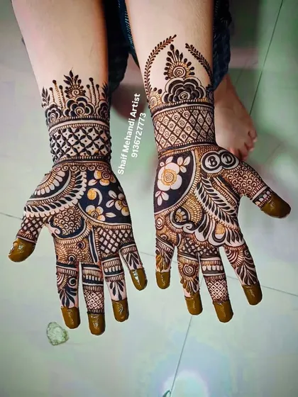 I enjoy playing with different techniques, like using negative space to make the central motifs pop. This design combines bold floral elements with traditional patterns and solid fingertips for a modern yet classic feel.