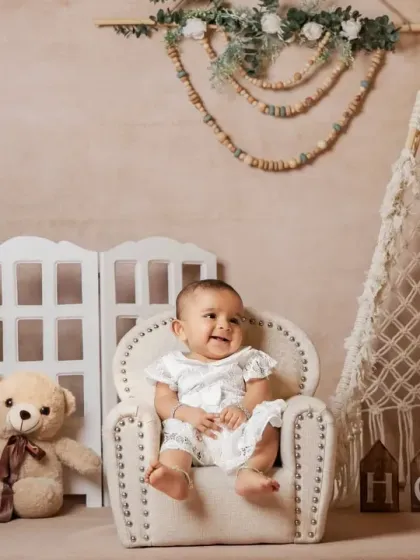A happy baby girl in her armchair, part of our "Boho Home" setup.