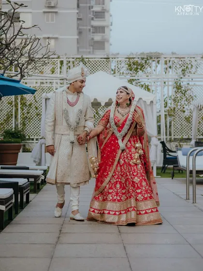 A candid shot of the newlyweds walking hand-in-hand after the ceremony. This is the kind of unscripted, happy moment we love to capture.