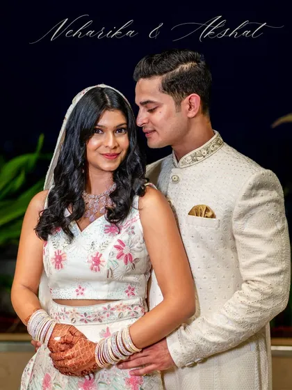 A classic, romantic portrait of Neharika and Akshat, their names elegantly scripted above them.