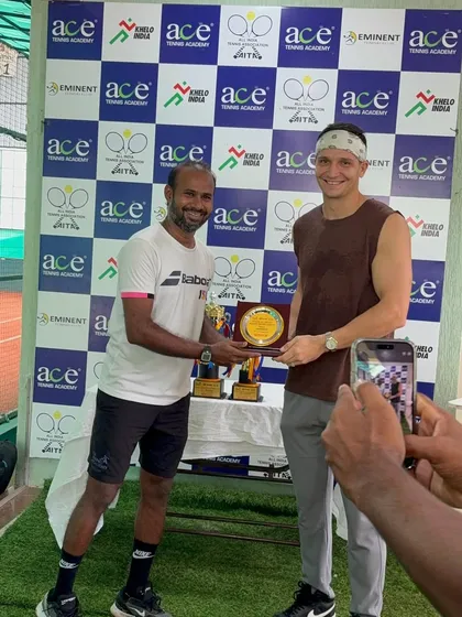 Presenting an award to a deserving player at the Ahmedabad tournament. It's rewarding to see players recognized for their hard work.