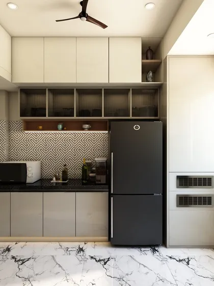 This angle highlights the smart storage solutions, including overhead cabinets and a tall unit housing the refrigerator and microwave.