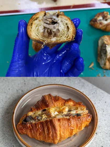 A look inside our Cheesy Mushroom Croissant, showing the generous, savory filling encased in flaky pastry.