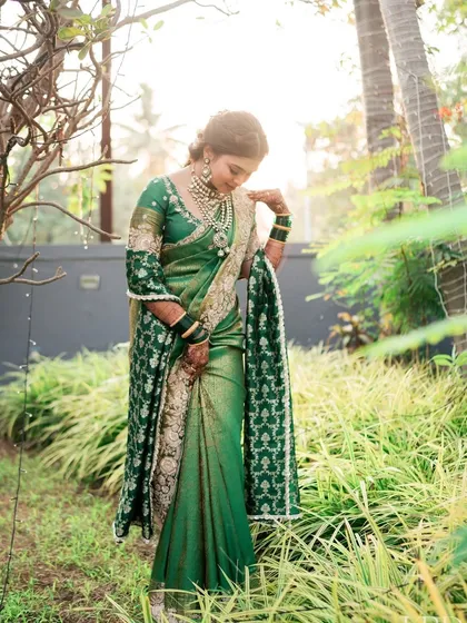 Draped in a stunning green saree, this bride looks like a vision. I gave her a minimal glam look with subtly defined eyes and glowing skin to match the elegance of her traditional Maharashtrian wedding attire.