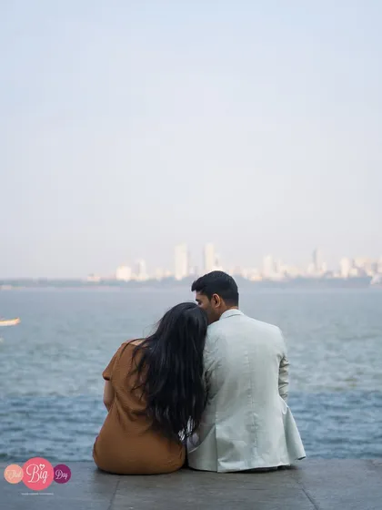 A quiet moment for Riyaz and Samreen, looking out at the Mumbai skyline from the water's edge. A classic and romantic city-meets-sea portrait.