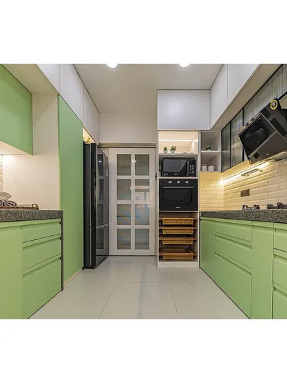 A vibrant and refreshing kitchen featuring pistachio green cabinets. This parallel layout is designed for efficiency, with everything within easy reach.