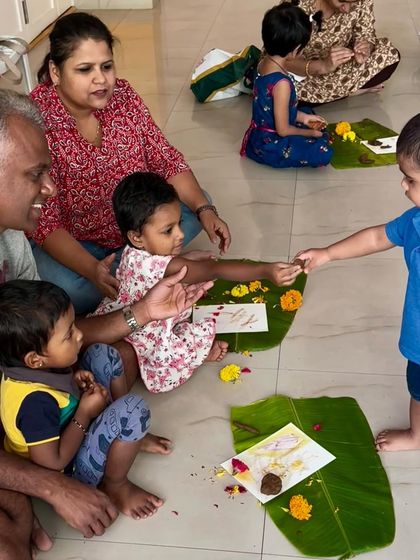 A beautiful moment of sharing between children, with family all around. Our workshops foster a sense of community where families can interact and children can learn from each other in a safe, nurturing space.