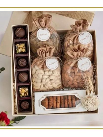 A classic and elegant Diwali gift, this box contains premium chocolates, cookies, and four jute potlis filled with assorted dry fruits. It's a timeless choice for both personal and corporate gifting.