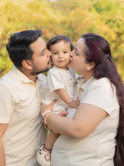 Kisses from mom and dad! My outdoor sessions are all about capturing those sweet, unposed moments of love. The beautiful natural light and relaxed setting let your family's true affection come to life.