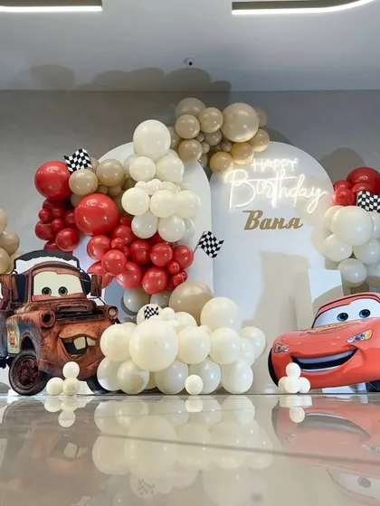 The Cars-themed backdrop reflected on a glossy floor, creating a cool effect for photos.