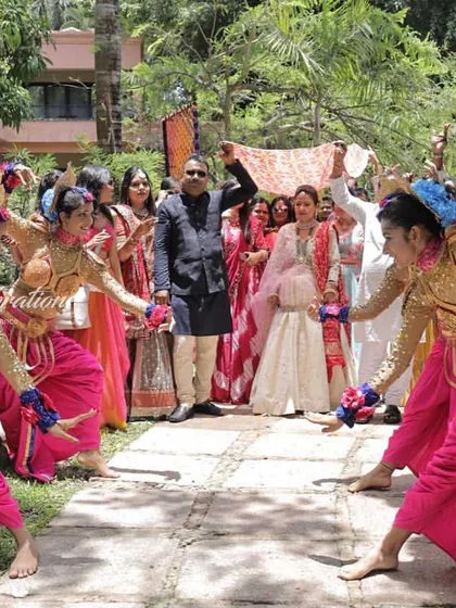 The family's entrance for the Bhaat ceremony is a full procession with dancers and music. I ensure that every part of the wedding celebration is filled with energy and beautiful visuals.