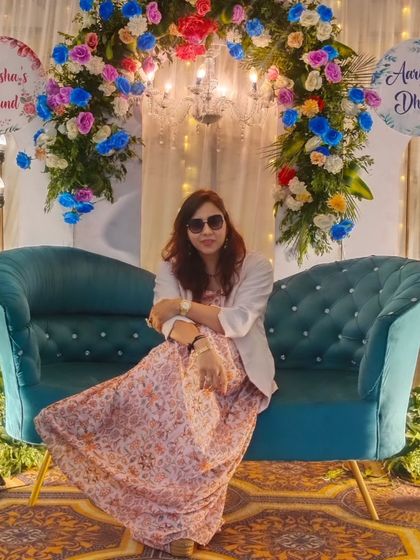 Taking a moment on the beautifully decorated stage for the Dhund ceremony. The floral arrangements and elegant seating created a lovely ambiance.