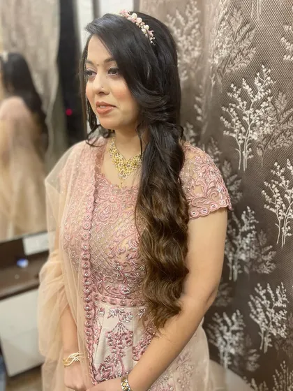 A portrait of the client, her hair styled for a fairy-tale feel.