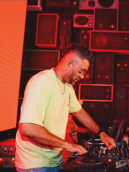 Focused on the mix at Bombay Adda, Bangalore. The wall of speakers behind me is the perfect backdrop for a bass-heavy set.