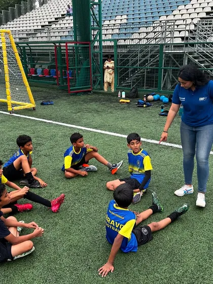 A small group of players receives focused instruction during a sports psychology workshop. This demonstrates the personalized attention we provide for mental skills training.