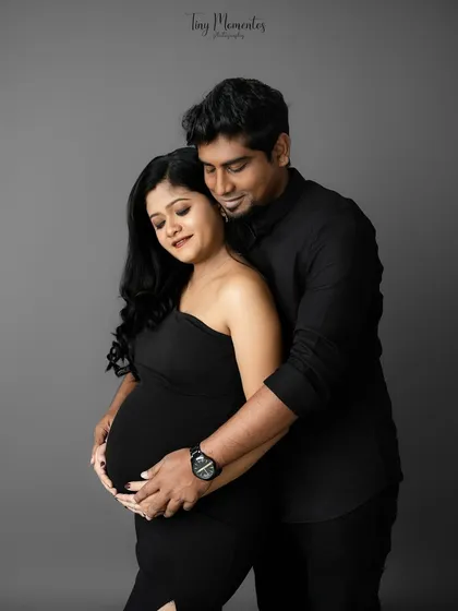 Wrapped in a loving embrace, this portrait showcases the protective and nurturing bond between partners during pregnancy.