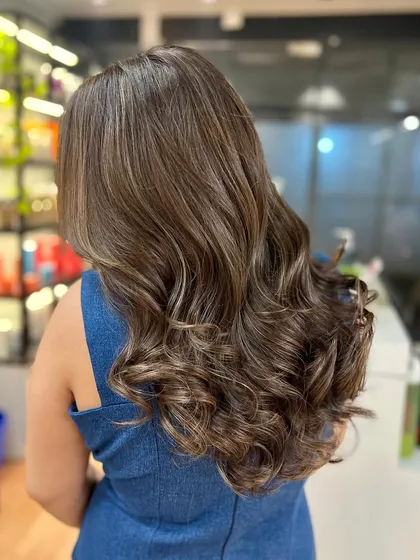 The back view of the ash brown color, showing the depth and dimension created by the highlights.