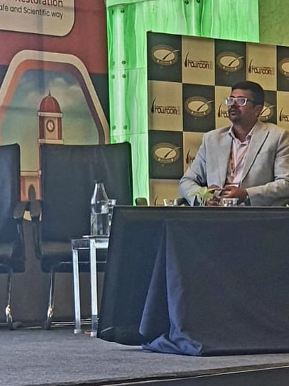 Chairing a video session at the annual meeting of Hair Transplant surgeons in India. These forums are vital for open discussion and peer review.