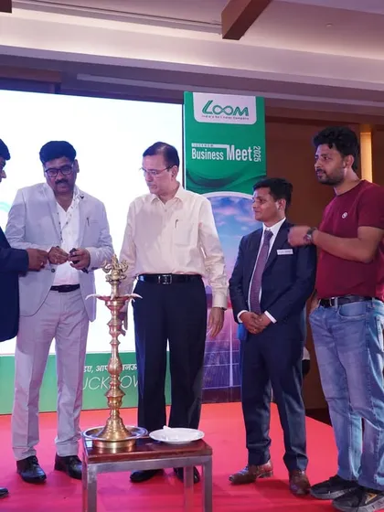 The ceremonial lighting of the lamp to inaugurate the Loom Solar Dealer Business Meet 2025 in Lucknow.