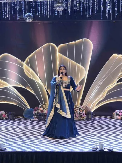 Commanding the stage during a grand social celebration. The set design was incredible, and my job was to match that grandeur with my performance, ensuring the night felt as magical as it looked.