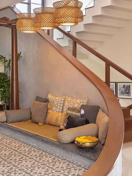 A close-up of the sunken seating area, showing the comfortable cushions and the beautiful patterned tiles. This space is perfect for informal family gatherings, echoing the communal spaces of traditional homes.