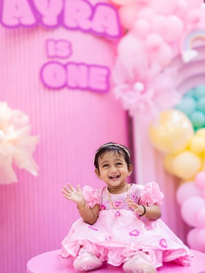 The birthday girl Ayra looking absolutely adorable at her rainbow-themed first birthday party.