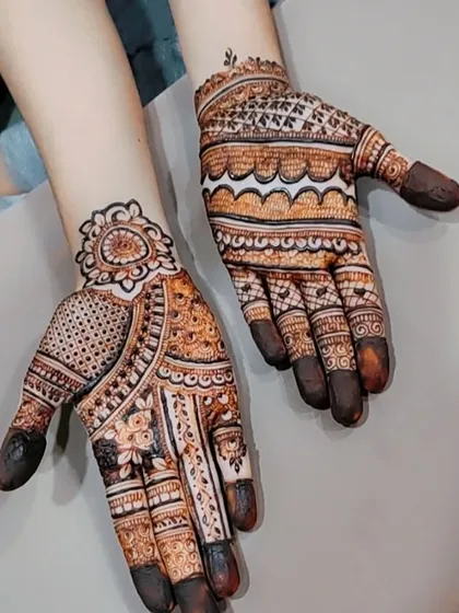 A semi-bridal design with a mix of patterns, including a beautiful mandala on the wrist.