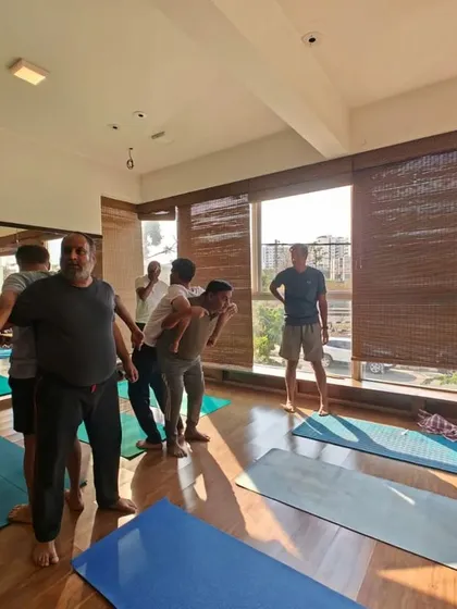 In my partner workshops, we explore fun and creative ways to practice together. This exercise helps with balance and core strength while fostering teamwork.