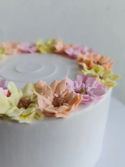 A close-up of the multi-colored buttercream flowers.