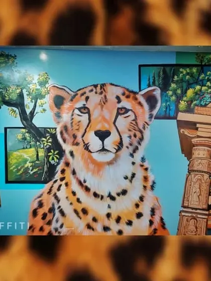 This cheetah mural was painted for the Indore airport. The artwork celebrates the local wildlife and heritage, providing a beautiful welcome for travelers.