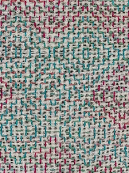 A detail of the counted-thread embroidery on the pouch. The repeating diamond pattern is meditative to stitch and lovely to look at.