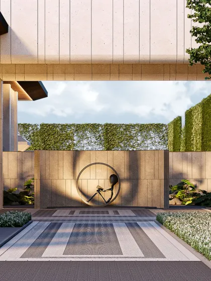 This spatial courtyard is a frame where light, shadow, and texture converge to honor stillness. A bronze sculpture provides a quiet counterpoint to the rigor of stone and geometry, grounding the space with presence and pause.