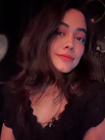 A simple, happy selfie. My goal is to make the songwriting process feel personal and comfortable.