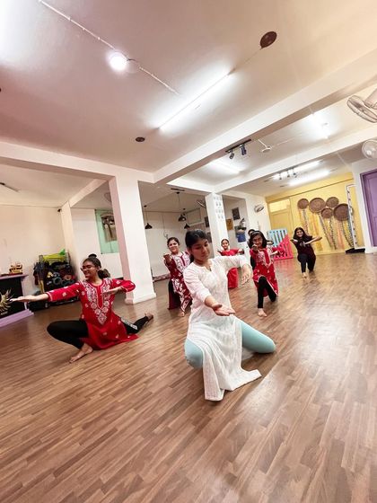 A dynamic moment captured during our semi classical class, with dancers in various expressive poses across the studio floor.