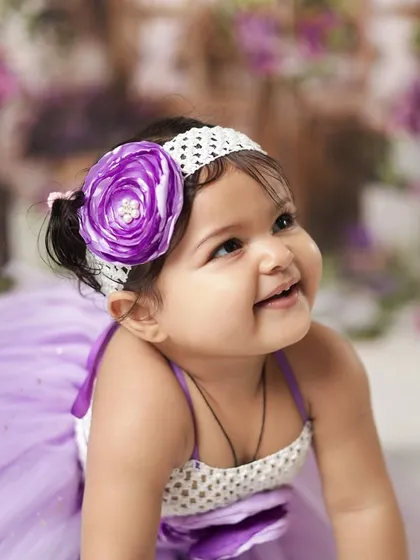 A happy, upward glance from a crawling baby. We capture them on the move too, showing their energy and playful spirit.