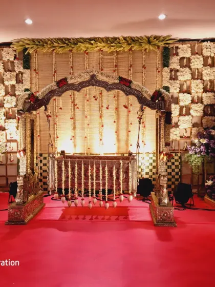The same beautiful traditional cradle from the featured section, shown here with a red carpet leading up to the stage.