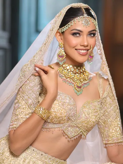 The joy of a bride on her special day is everything. This ivory glam look is all about enhancing her natural beauty with soft, luminous makeup, a gentle smokey eye, and a radiant smile that lights up the frame.