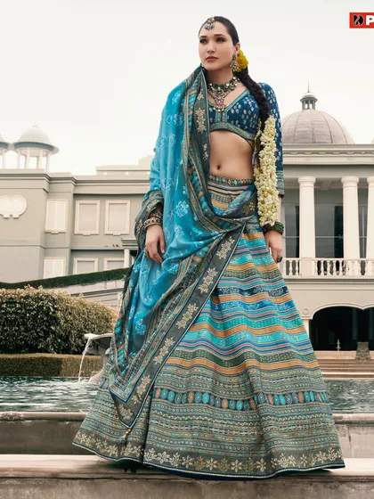 Step into a world of beauty with this fabulous blue multi-tonal lehenga, a perfect rental to make a statement.