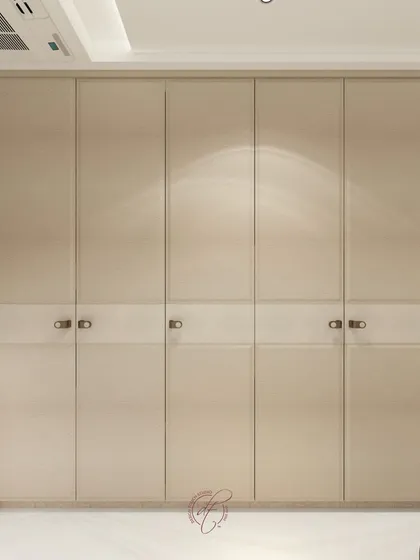 A close-up detail of the minimalist wardrobe design, showcasing the clean lines and high-quality finish we aim for in our projects.