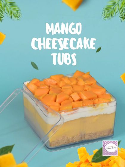 A closer look at the Mango Cheesecake Tub, layered with a biscuit base, creamy cheesecake, and topped with fresh mango chunks.