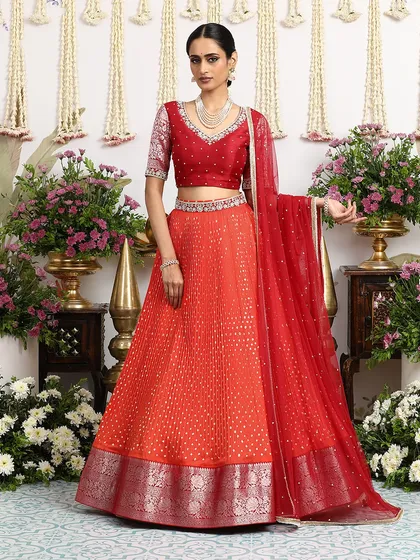 A full-length view of the orange Bandhani lehenga, perfect for a bride who wants to make a colorful statement.