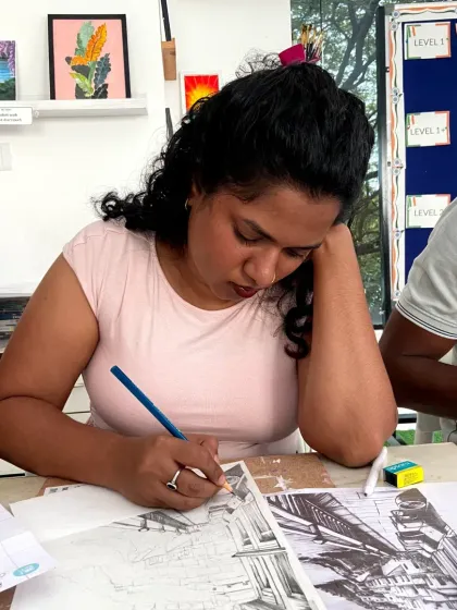 A student in our sketching course working on an urban sketching piece. The course explores different styles and techniques.