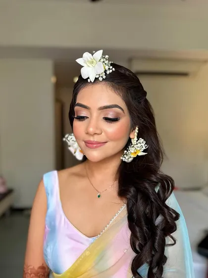 The perfect Haldi glow, with eyes closed to show the subtle shimmer and flawless blending.