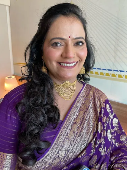 A happy smile from the mother of the bride. The right makeup can boost confidence at any age.